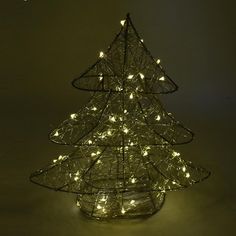 Start off your Christmas decorations with this free standing 3D Metal Wire Christmas Tree! Ready to decorate however you want and will surely brighten your Christmas this season! The lights are always flashing and warm light color and will dazzle you every time you turn it on.Height: 12" Length: 10.5" Width: 3" Pre Lit Metal Christmas Tree, Large Punched Metal Christmas Star And Christmas Tree Display, Metal Christmas Tree Lights Outdoor, Wire Christmas Tree Michaels Stores, Metal Christmas Tree Porch, Pipe Christmas Tree Metal, Wire Christmas Tree, Lead Metal, Fall Ribbons