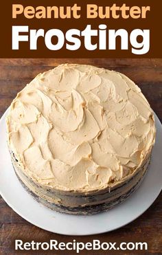 a close up of a cake on a plate with the words peanut butter frosting