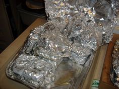 aluminum foil wrapped in silver foil sitting on top of a table