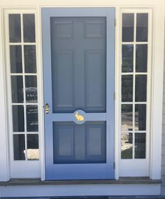 a blue front door with two windows and a sign that says welcome to the house