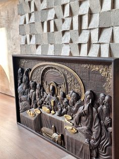 an intricately carved wooden panel depicting the last supper