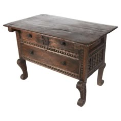 A extremely rare early 18th-century Spanish Colonial table, a remarkable piece showcasing the enduring beauty and functionality of colonial craftsmanship. This table is constructed from solid wood, displaying an aged patina that speaks to its centuries-old heritage. The front features two spacious drawers, each adorned with original iron hardware, exuding a rustic yet refined elegance. The carvings along the edges are intricate, with foliage motifs that highlight the artistry typical of the peri Spanish Colonial Furniture, Colonial Table, Spanish Furniture, Colonial Furniture, Colonial Design, Carved Legs, Iron Hardware, Spanish Colonial, Colonial Style