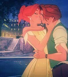 the princess and the frog kissing in front of a castle