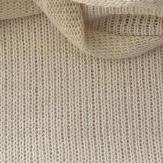 close up view of white knitted fabric