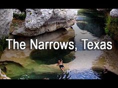 the narrows, texas river is surrounded by large rocks and water with people swimming in it