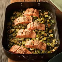 salmon and brussels sprouts in a roasting pan