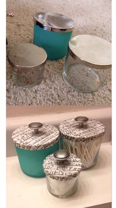 three glass containers with lids on top of a counter