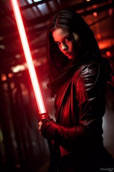 a woman holding a light saber in her hand