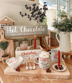 hot chocolate and marshmallows in mugs on a wooden tray with christmas decorations