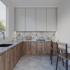 a kitchen with marble counter tops and wooden chairs in front of the sink, along with white cabinets