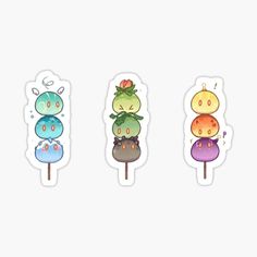 four stickers with different colored candies on them