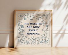 a framed poster with the words, his mercies are new every morning on it