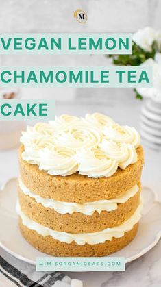 vegan lemon chamomile tea cake on a white plate with flowers in the background