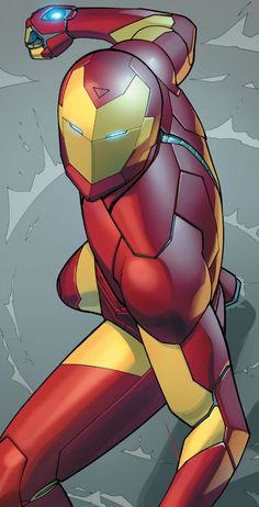 an iron man is standing in front of a rock wall with his hands on his hips