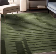 a green area rug in a living room