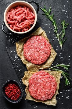 raw ground beef patties with herbs and spices