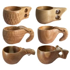 several wooden bowls and spoons are shown in different positions, including the handles with holes on them