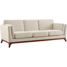 a white couch with wooden legs on a white background