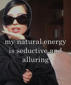 a woman wearing sunglasses with the words, my natural energy is seductive and alluring