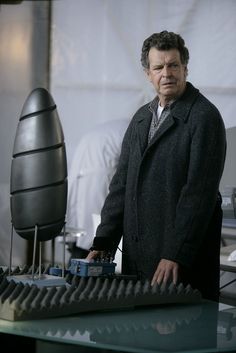 a man standing in front of a computer keyboard