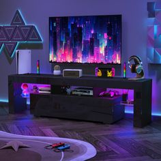 an entertainment center in a living room with colorful lights on the wall and a large flat screen tv mounted above it