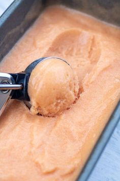 a scoop of ice cream in a metal pan