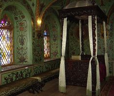 an elaborately decorated room with stained glass windows