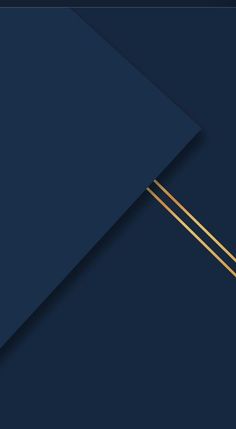 two gold sticks sticking out of the side of a dark blue paper