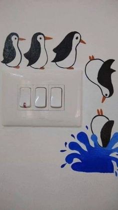 three penguins are on the light switch cover