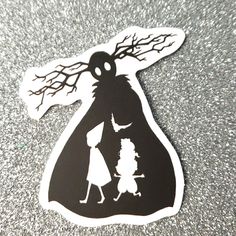 a sticker with an image of a woman holding a child's hand