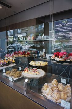 a display case filled with lots of different types of pastries