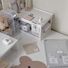 a white desk topped with lots of crafting supplies