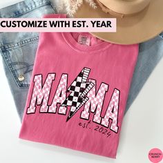 This Lightning Bolt Mama Personalized Mama Shirt for New Mom is the perfect Custom Mother's Day Gift for the new mama! Our Comfort Colors tees are super soft, DTG printed (printed with ink), and 100% cotton. ❗❗There may be a slight difference in the colors due to different monitors. ❗❗ 🌞 HOW TO ORDER 🌞 * Select your size and color from the drop-down menu * Add your shirt to cart. If you would like more than one, add each one to cart individually. * Proceed to check out! * Your shirt will be ready to ship in 1-3 days! 🌞 SIZING 🌞 Check the Size Chart and Fit Guide in the photos for reference! 🌞 PRODUCTION + SHIPPING 🌞 * Order Production: 1-3 business days  * Standard Shipping: 1-5 business days after production time 🌞 SHIRT DETAILS 🌞 * 100% combed and ring-spun cotton * Relaxed fit * New Mama Gift, Momma Shirts, New Mama, Mom Tshirt, Mama Gifts, New Mom Gift, Comfort Colors Tee, Mama Shirt, New Mom