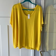 Great Summer Shirt Or Layering Piece, Bright Color And Lightweight Gap Tops For Spring, Gap Oversized Long Sleeve Tops, Oversized Long Sleeve Gap Tops, Oversized Cotton Tops By Gap, Gap Basic Summer Tops, Gap Relaxed Fit T-shirt For Spring, Yellow Oversized Crew Neck Tops, Oversized Yellow Crew Neck Top, Oversized Yellow Casual Blouse