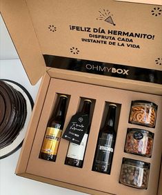 an open box containing six different types of food and condiments, including pasta