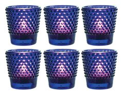 six purple and blue glass cups sitting next to each other