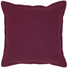 a dark red pillow on a white background