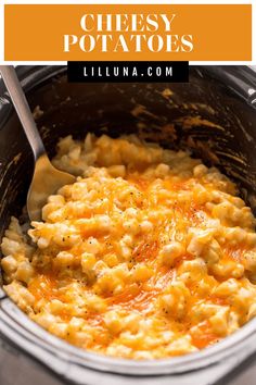 a bowl filled with macaroni and cheese on top of a table