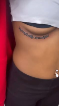 a woman's stomach with the words practically beautiful written on her lower back side