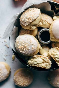 an assortment of pastries in a black bowl