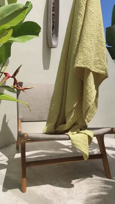 a towel is hanging on the back of a chair