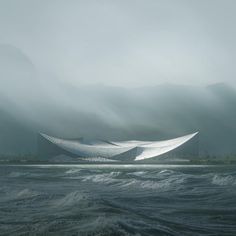 a large white boat floating on top of a body of water next to tall mountains