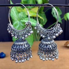 Perfect with ethnic & traditional wear. Fancy Party Wear Traditional Jhumki Earrings. Perfect gift for any occasion for yourself and your dear ones. It is advisable to store jewellery in a zip lock pouch (air tight pouch), keep away from water perfume and other chemicals and clean it with dry and soft cloth. Silver Tilla Jhumkas For Festival, Traditional Festive Metal Hoop Earrings, Traditional Metal Hoop Earrings For Celebration, Traditional Oxidized Hoop Earrings For Festive Occasions, Temple Jewelry Festival Earrings With Latkans, Festive Metal Hoop Earrings In Temple Jewelry Style, Silver Bohemian Hoop Earrings For Celebration, Festive Oxidized Finish Hoop Earrings, Heavy Temple Jewelry Hoop Earrings