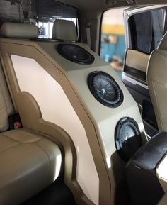 the interior of a vehicle with two speakers