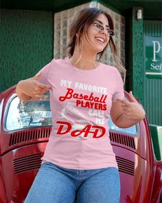 a woman wearing a t - shirt that says my favorite baseball players call me dad