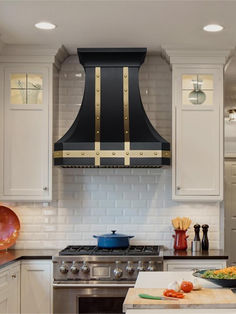 a stove top oven sitting inside of a kitchen