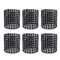 six black and white glass vases sitting next to each other