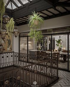 the interior of a house with potted plants and chandeliers