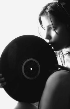 a woman holding a record in her hands