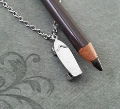 a pencil with a sharpener attached to it